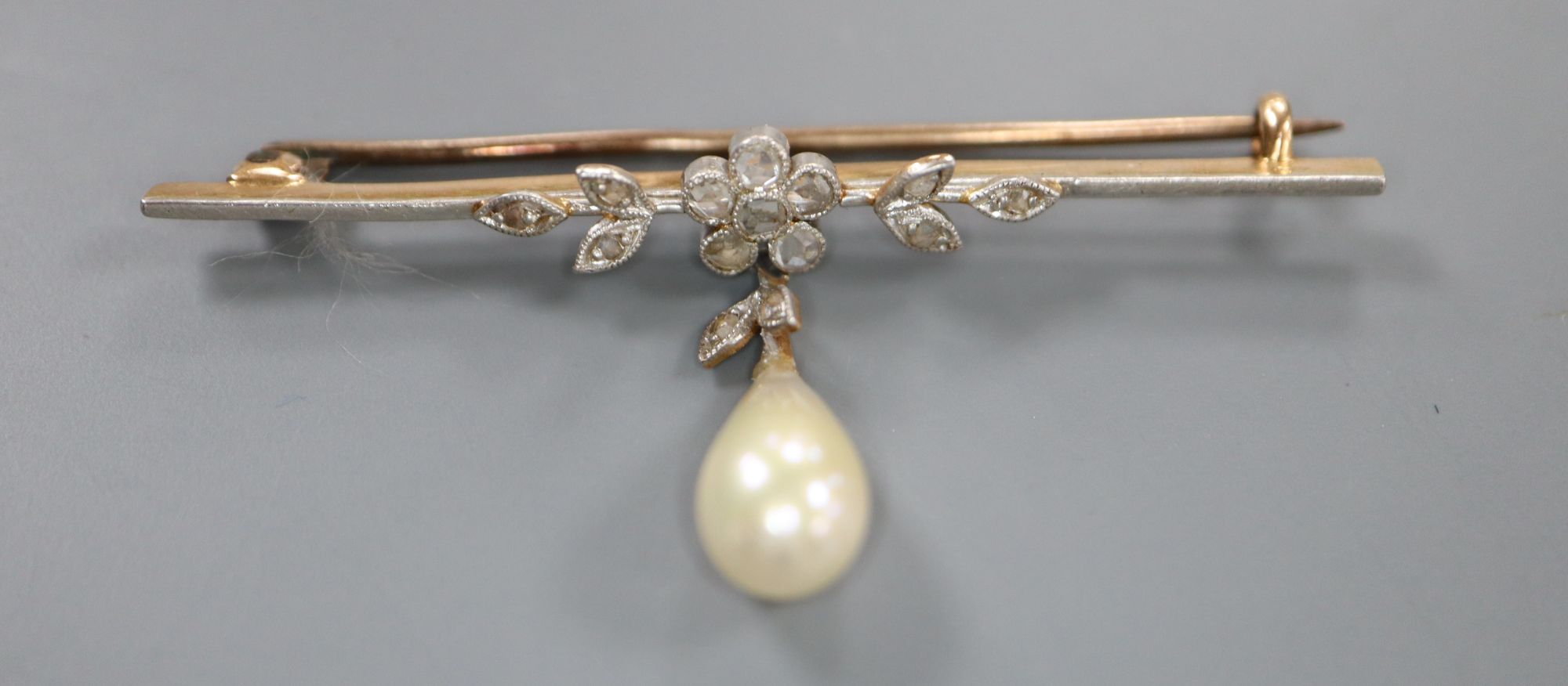 A 1920s yellow metal, rose cut diamond and simulated pearl drop set bar brooch, 52mm, gross 3.6 grams.